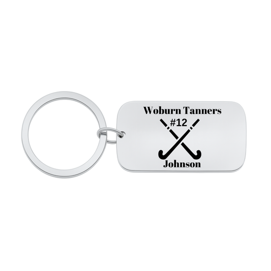Stainless steel engraved field hockey dog tag keychain with crossed sticks design and customizable text