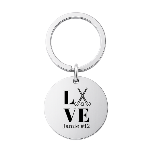 Stainless steel engraved field hockey keychain with LOVE design and custom name on white background
