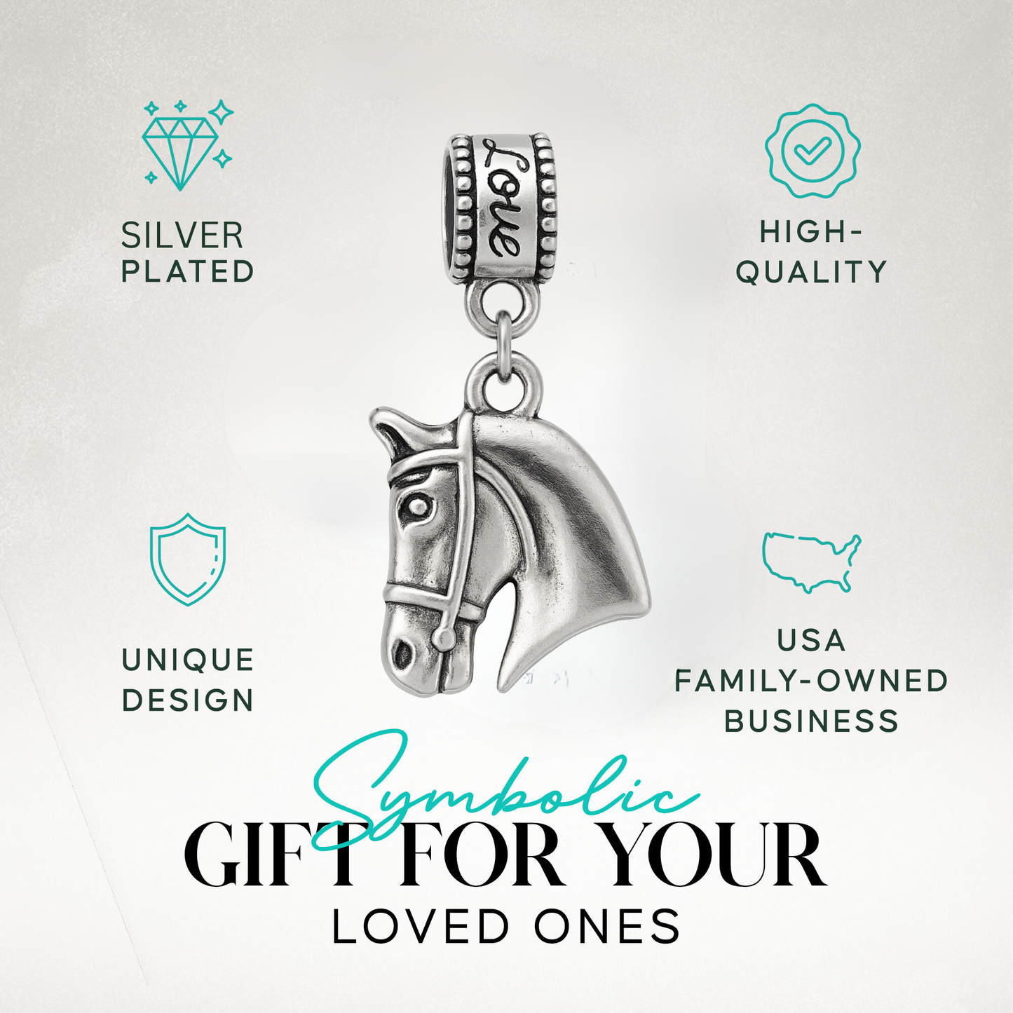 Horse head charm bead with 'Love' detail displayed on elegant jewelry dish