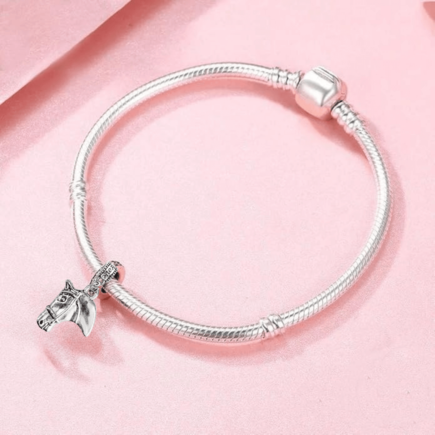 Horse head charm bead attached to silver bracelet for equestrian jewelry lovers