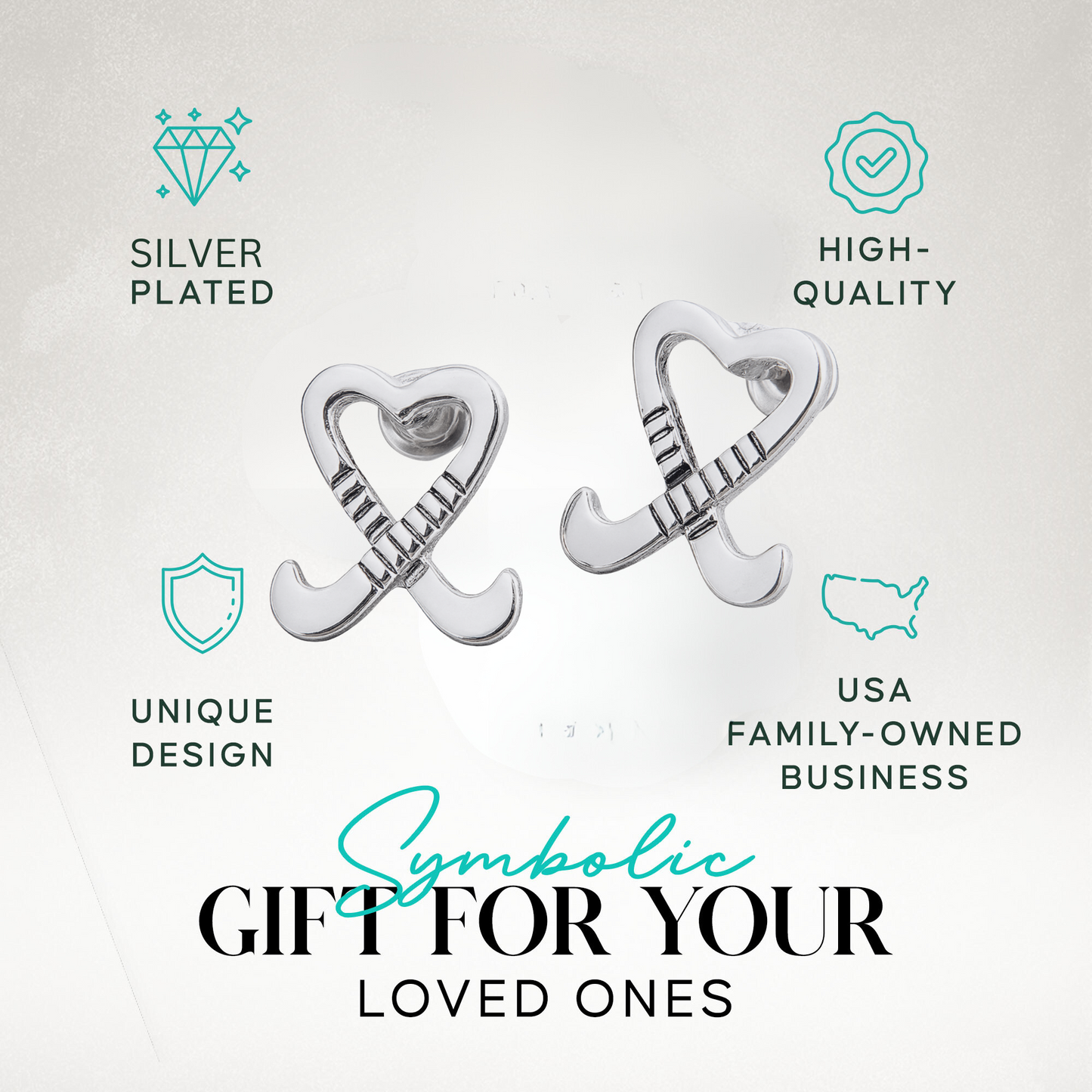 Heart stick earrings displayed on turf with field hockey ball for sporty gift presentation