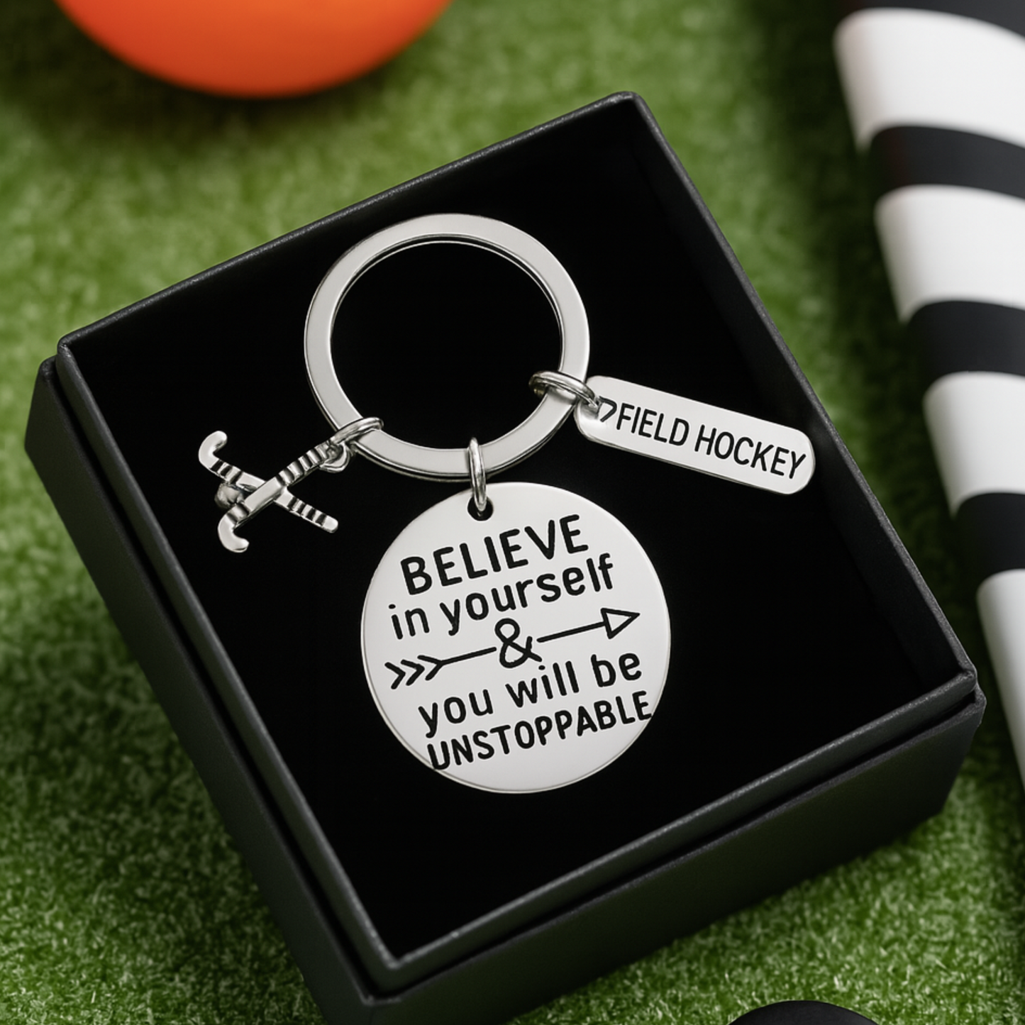 Field hockey keychain displayed in black gift box with motivational engraved charm for players and coaches