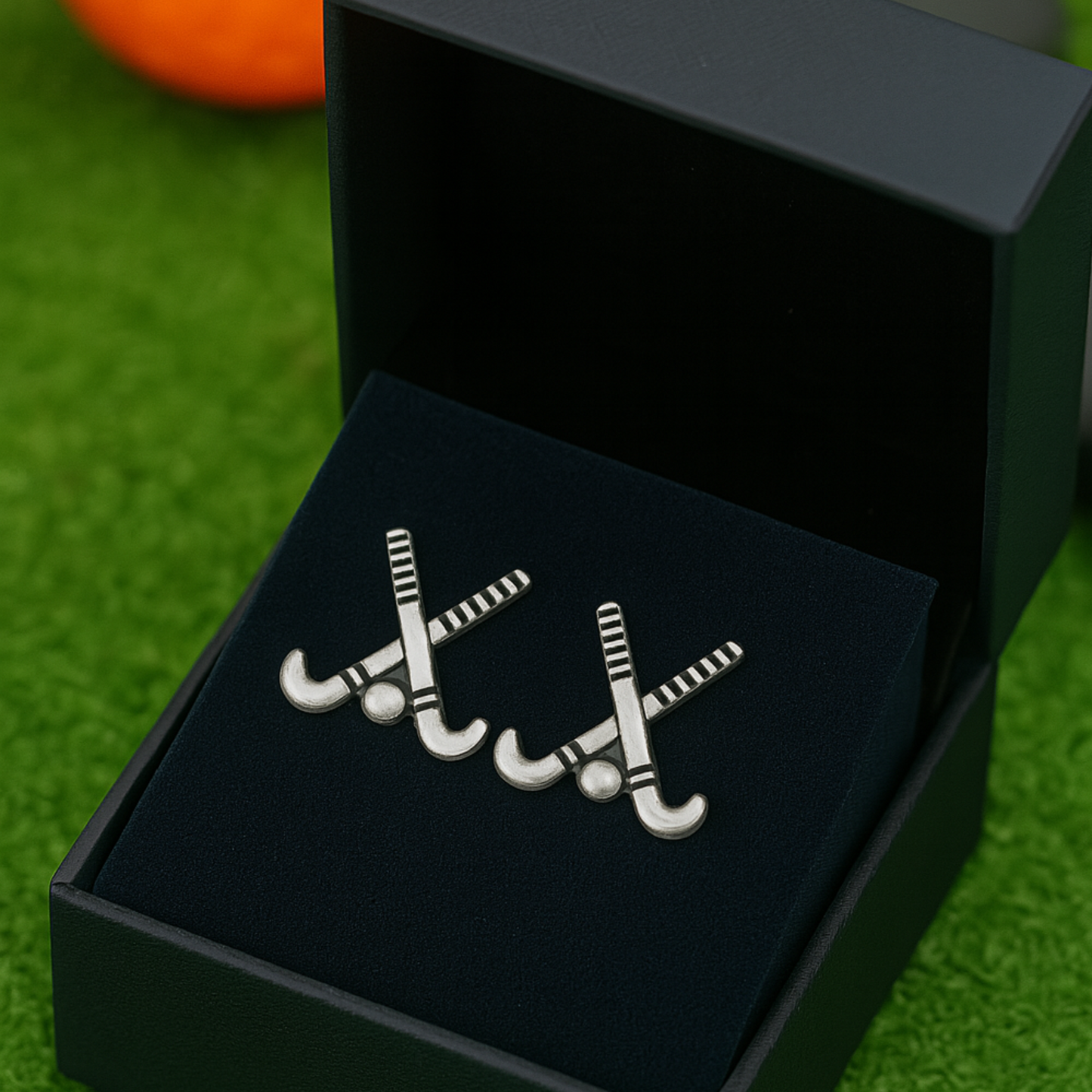 Field hockey charm earrings presented in elegant gift box, perfect for players and coaches