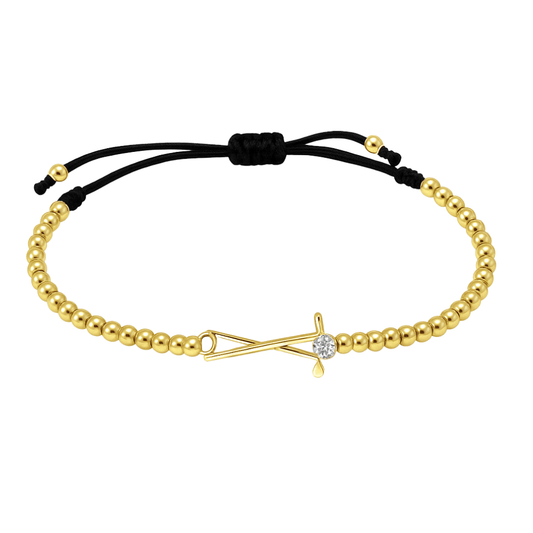 Gold beaded golf bracelet with rhinestone golf club charm and black adjustable cord