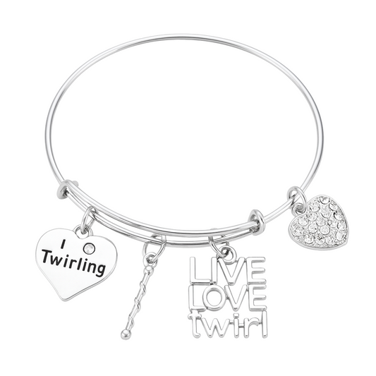 Silver twirling bangle bracelet with baton charm, heart pendant, and Live Love Twirl charm