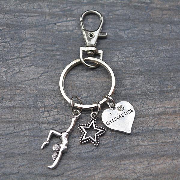 Silver I Love Gymnastics keychain featuring heart, star, and gymnast charms, perfect gift for gymnasts- Sportybella