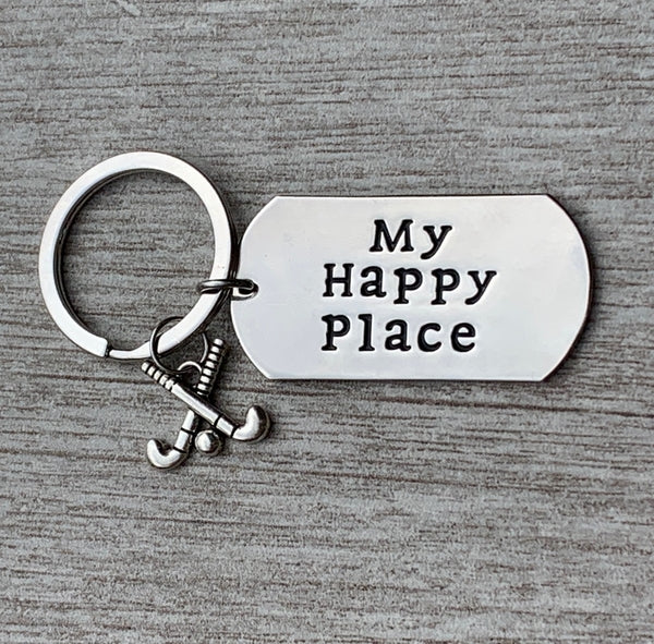 My Happy Place keychain shown on gray background with tag and field hockey charm