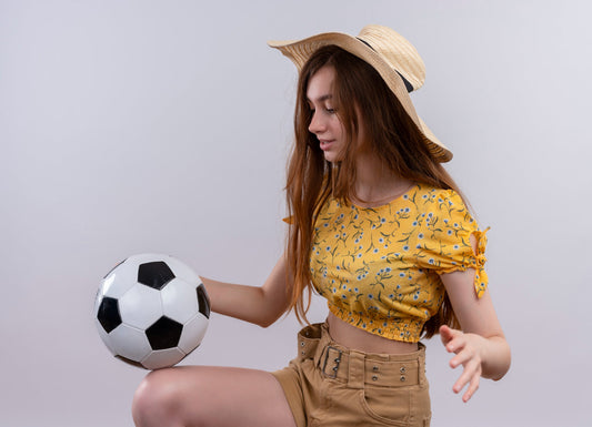 woman playing with a football
