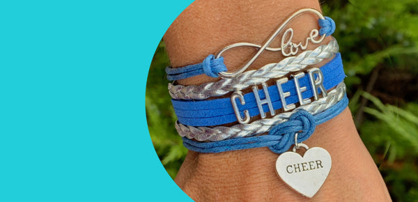 Infinity cheer bracelet in blue color with "Love to cheer" charm