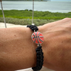 Black basketball rope bracelet worn on wrist outdoors, showing natural fit