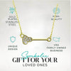 Elegant gold-plated lacrosse pendant necklace featuring clear rhinestones