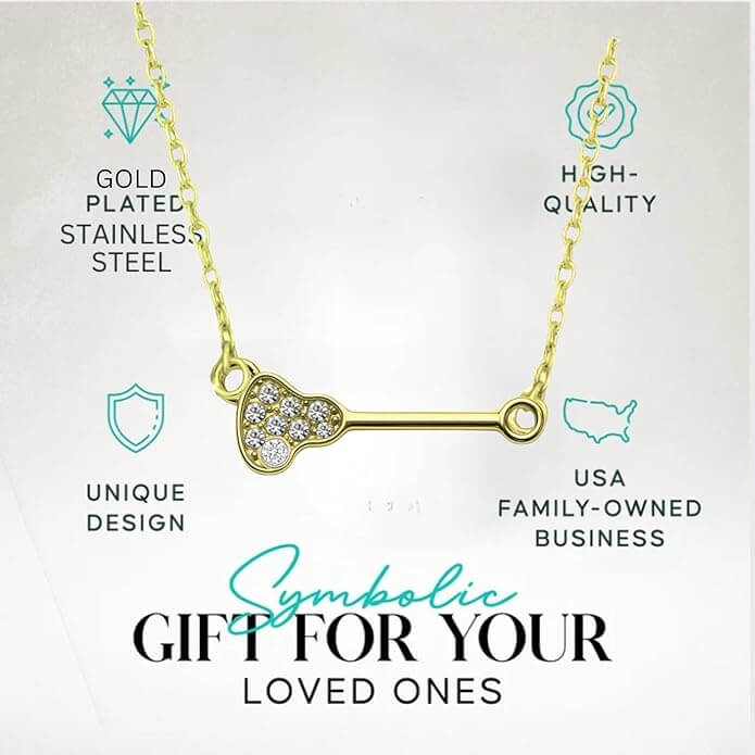 Elegant gold-plated lacrosse pendant necklace featuring clear rhinestones