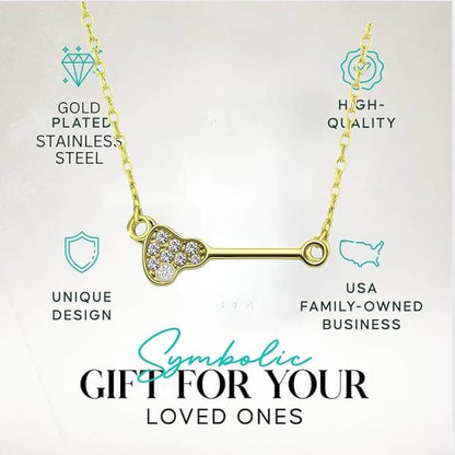 Elegant gold-plated lacrosse pendant necklace featuring clear rhinestones