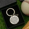  Baseball quote keychain shown on artificial turf with ball and gear in background