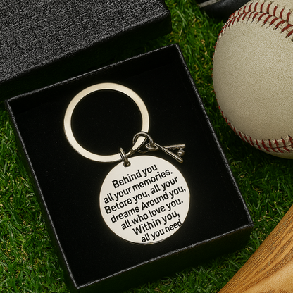  Baseball quote keychain shown on artificial turf with ball and gear in background