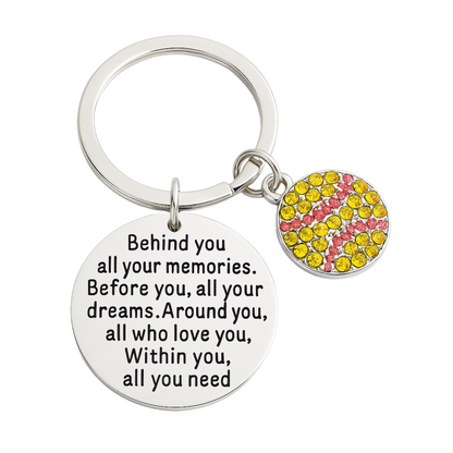 Inspirational baseball keychain with yellow softball accent charm on white background