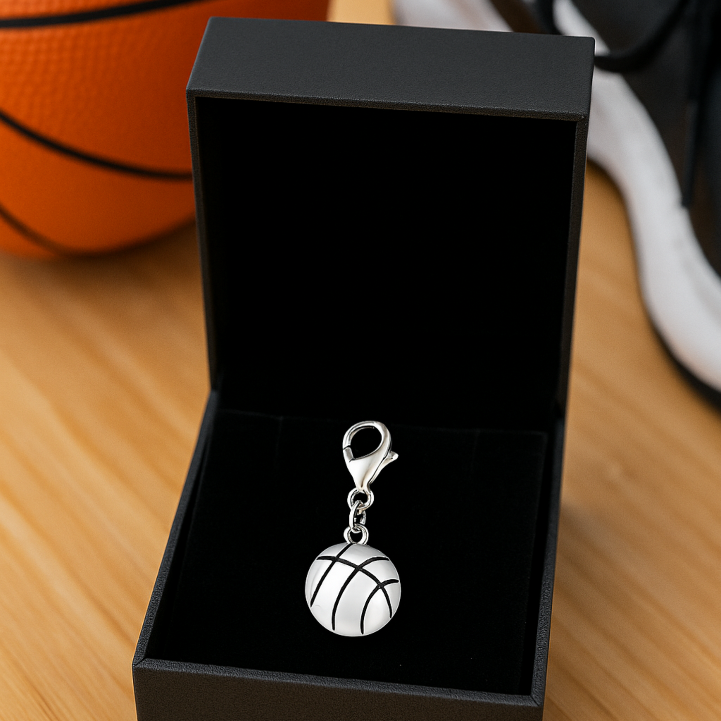  Round basketball charm displayed in a black gift box with secure lobster clasp