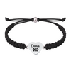 Black bracelet with “XC” charm