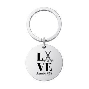 Stainless steel engraved field hockey keychain with LOVE design and custom name on white background