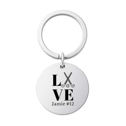 Stainless steel engraved field hockey keychain with LOVE design and custom name on white background