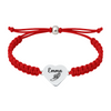 Red bracelet with polished heart charm engraved with winged shoe icon