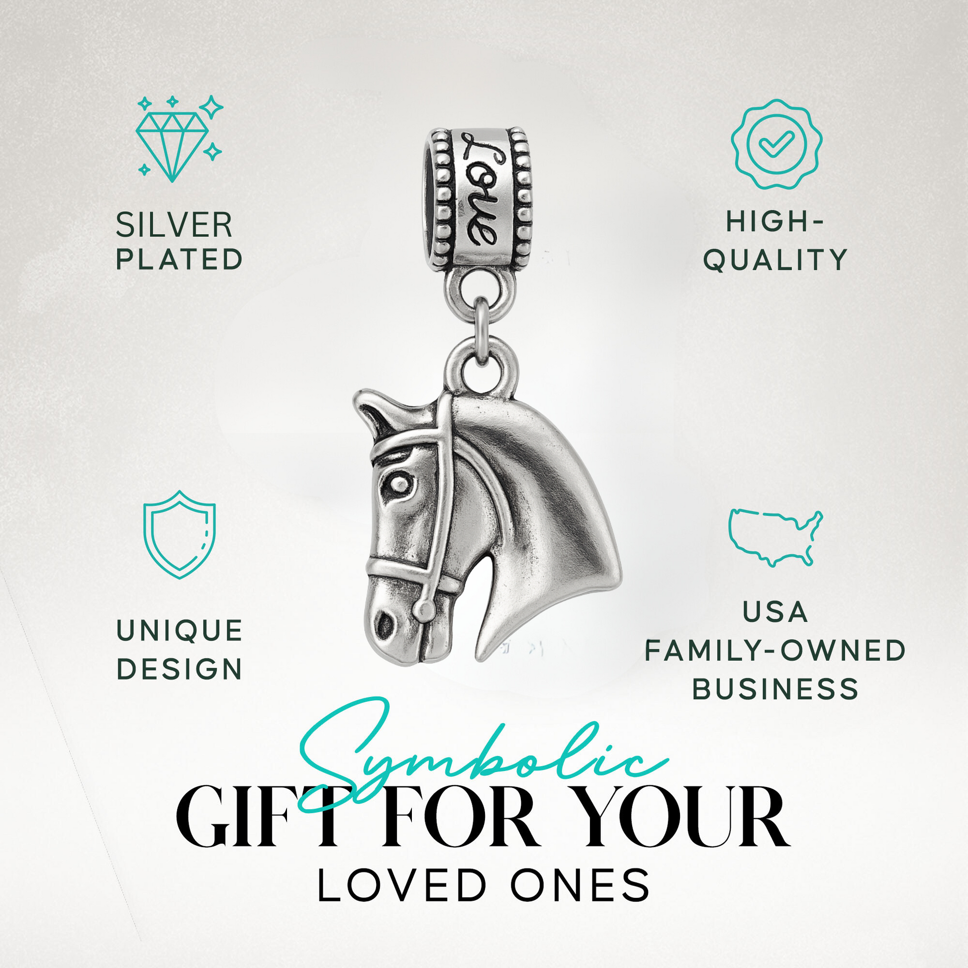 Horse head charm bead with 'Love' detail displayed on elegant jewelry dish