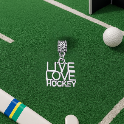LOVE hockey silver charm bead with crossed sticks displayed on artificial turf