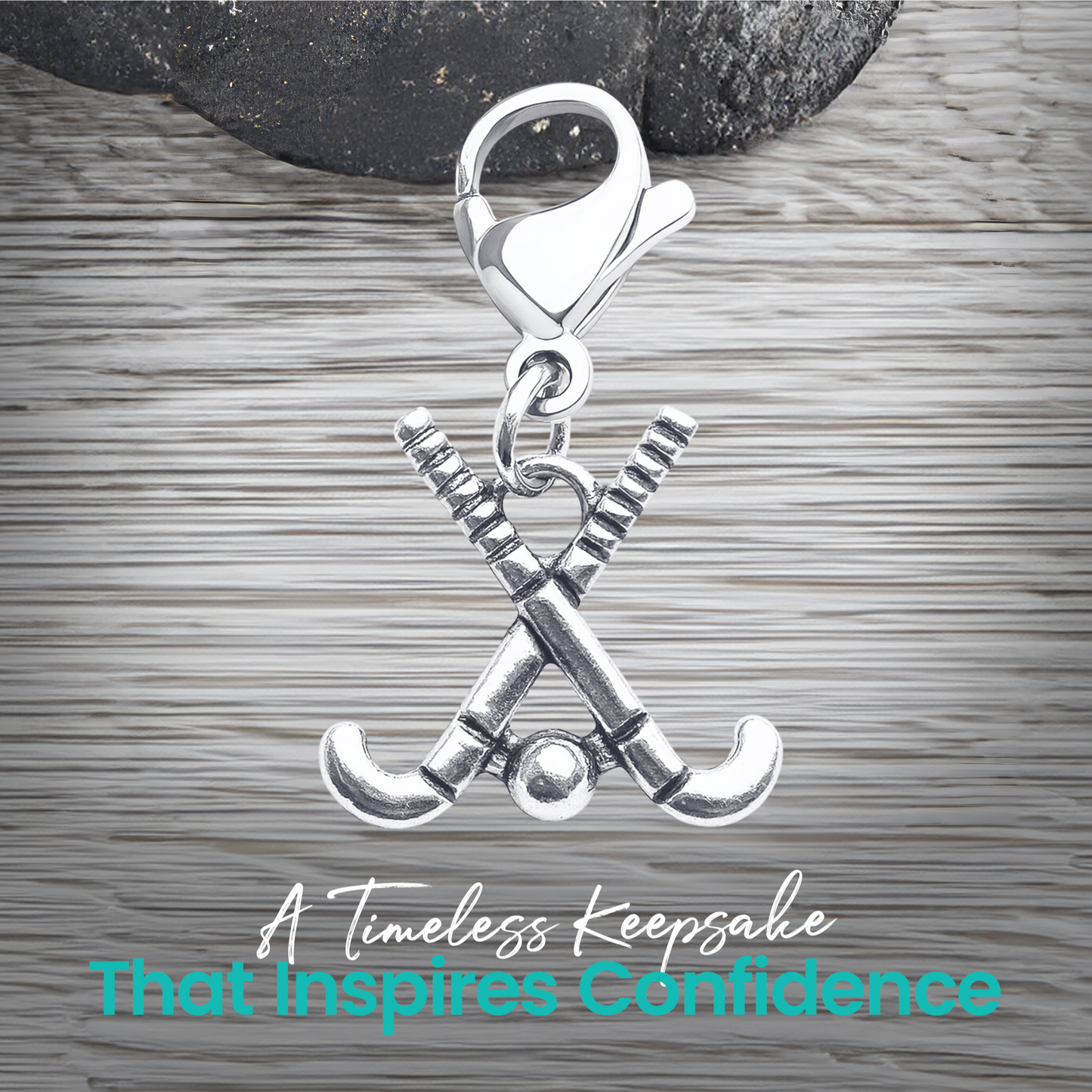 Silver field hockey zipper pull charm shown with text about unique design, durability, and gift idea