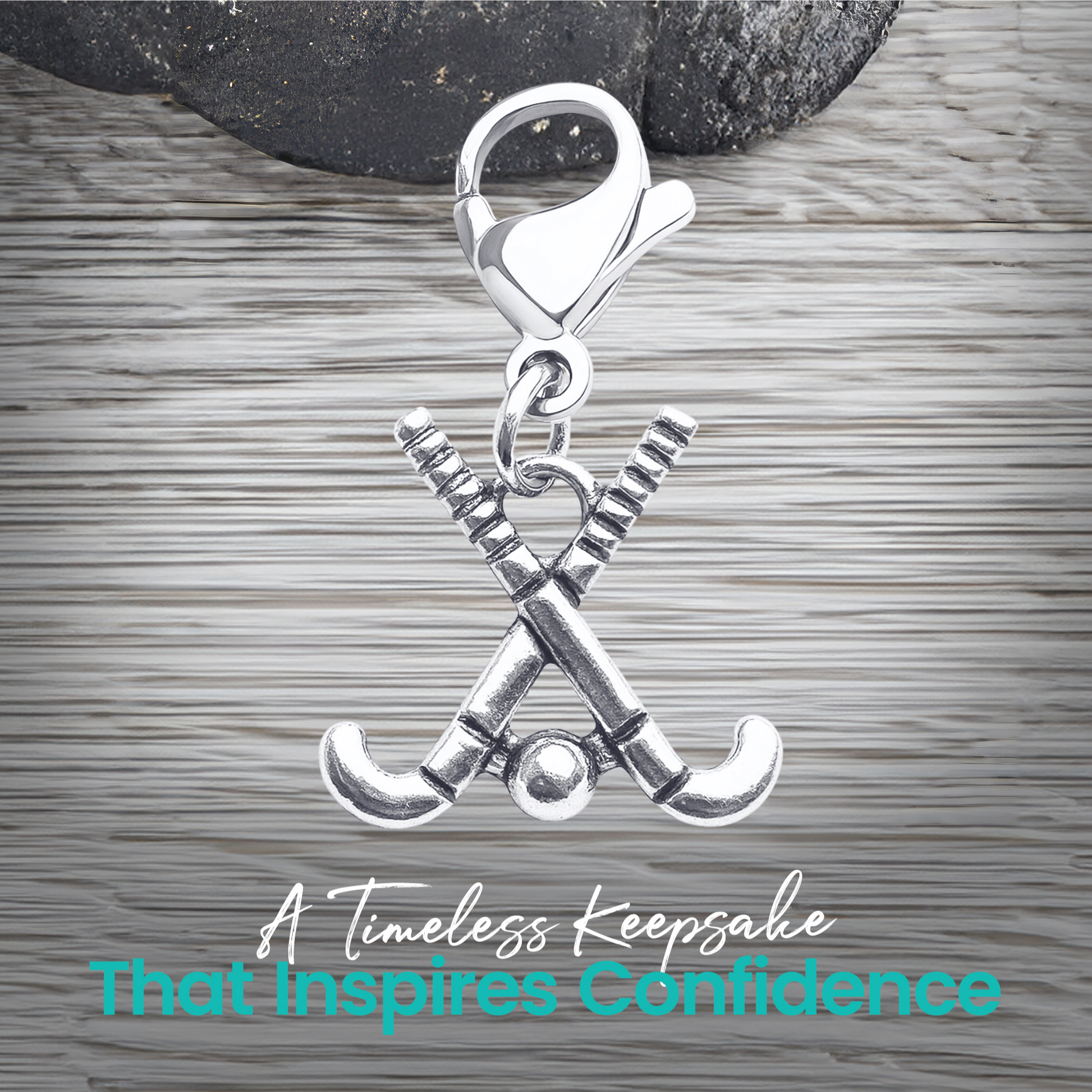 Silver field hockey zipper pull charm shown with text about unique design, durability, and gift idea
