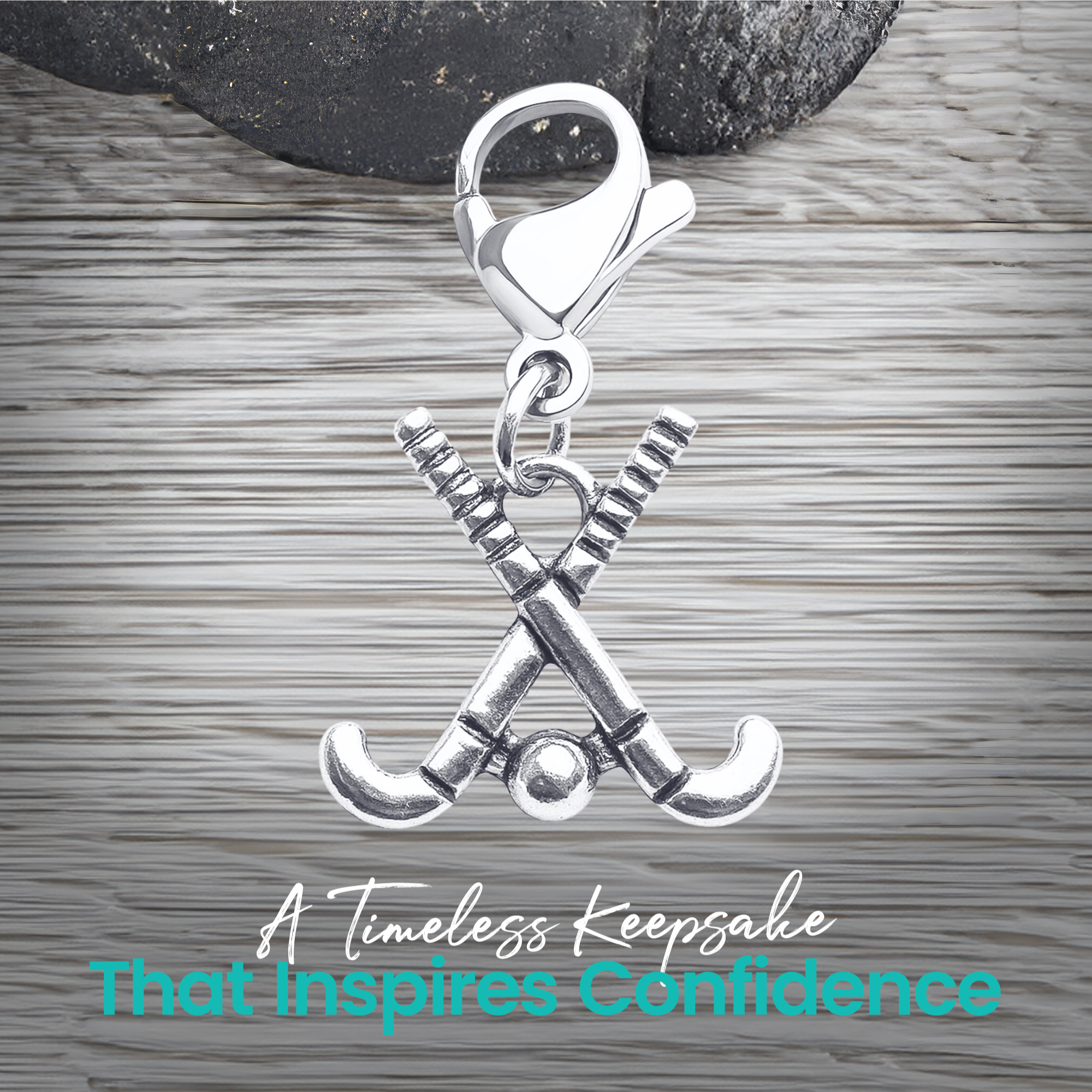 Silver field hockey zipper pull charm shown with text about unique design, durability, and gift idea
