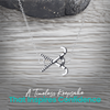 Field hockey necklace close-up with sporty gift-ready message card and pendant details