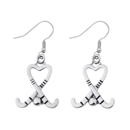 Silver heart-shaped field hockey stick dangle earrings with crossed sticks and ball design