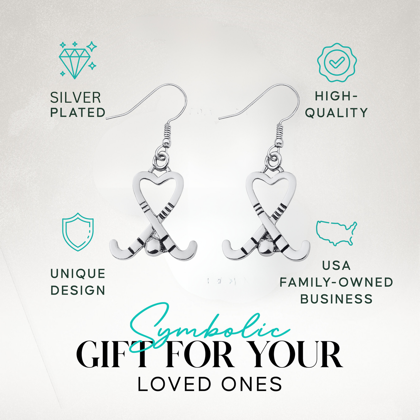 Silver heart-shaped field hockey stick earrings with text highlighting unique style and gift idea