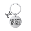 Silver plated field hockey keychain with crossed sticks charm and engraved She Believed She Could So She Did pendant