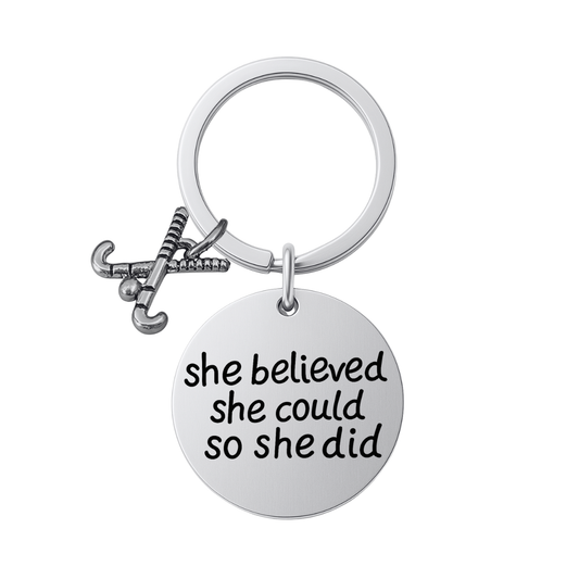 Silver plated field hockey keychain with crossed sticks charm and engraved She Believed She Could So She Did pendant