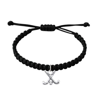 Adjustable black rope field hockey bracelet with crossed sticks charm on white background