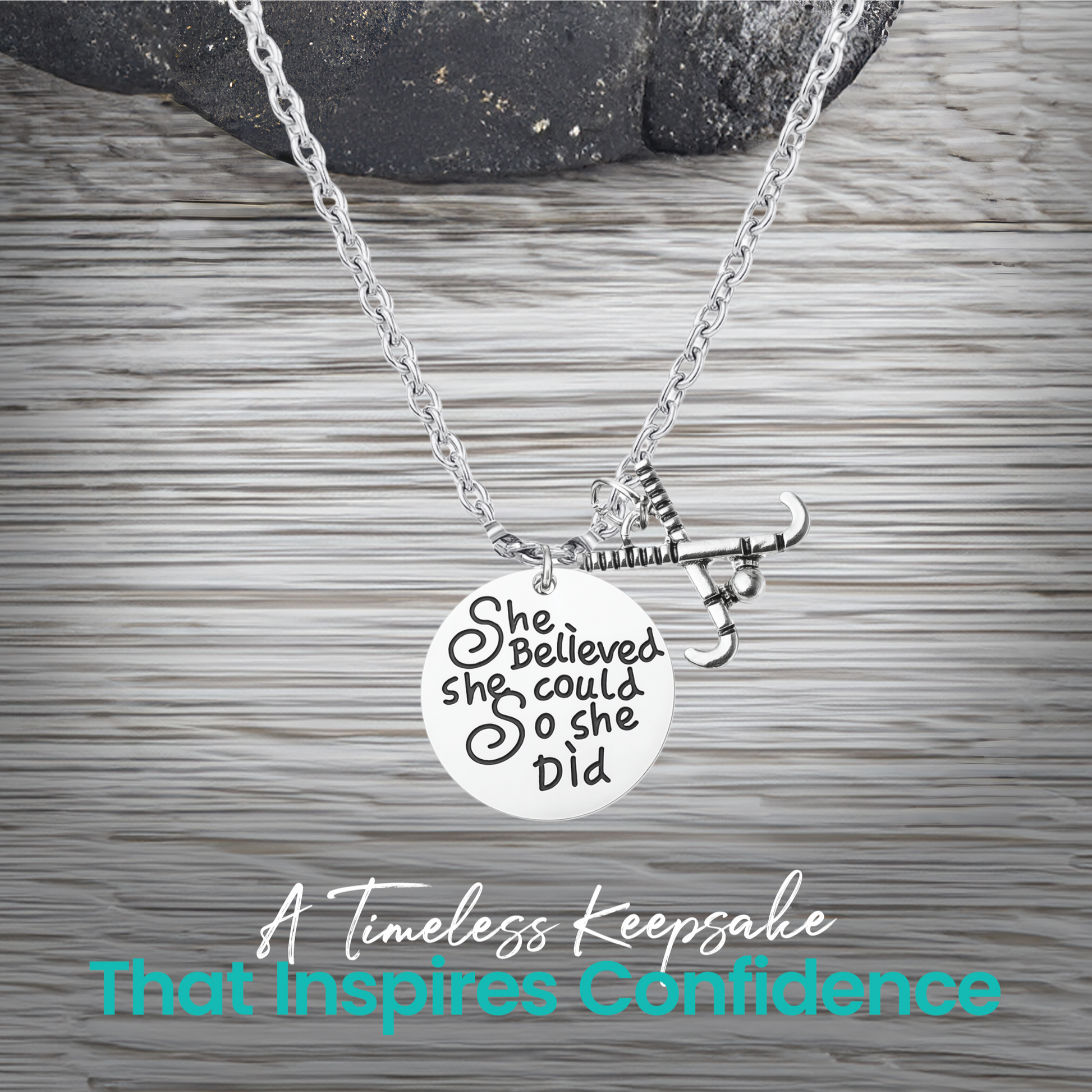 Silver She Believed She Could So She Did field hockey necklace on rustic wooden surface