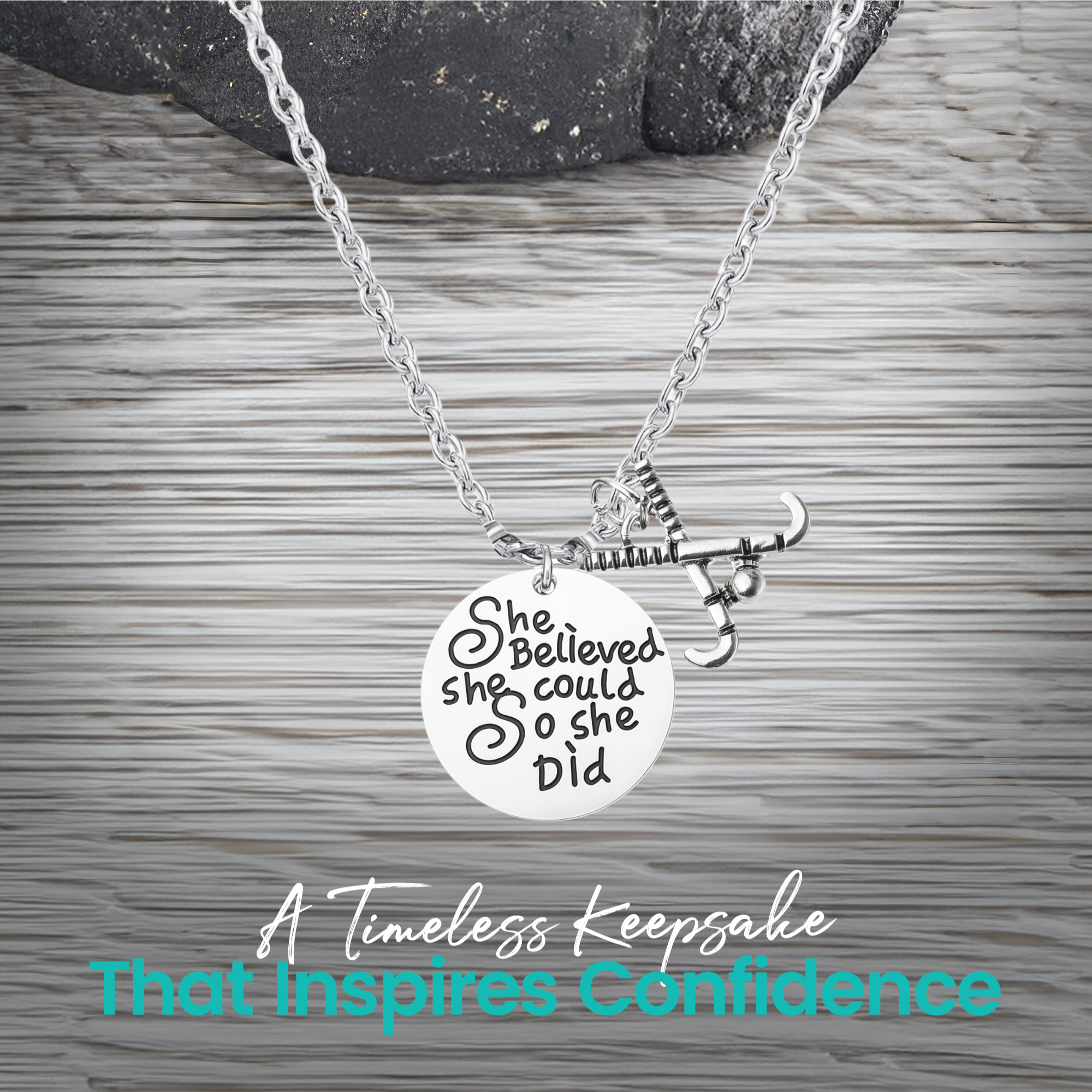 Silver She Believed She Could So She Did field hockey necklace on rustic wooden surface
