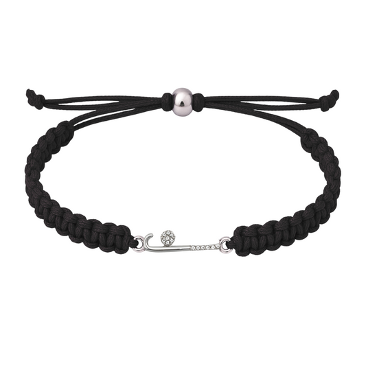Black braided rope bracelet featuring a silver rhinestone field hockey stick charm, laid flat on white background