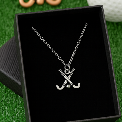 Close-up of silver field hockey necklace showing charm detail and chain