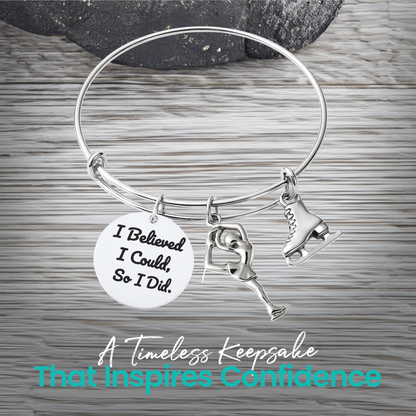 Figure skating bracelet with Believe in Yourself charm and ice skate charm displayed on rustic wood surface
