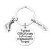 Silver figure skating coach keychain with engraved quote 'A great coach is hard to find and impossible to forget' and thank-you charm