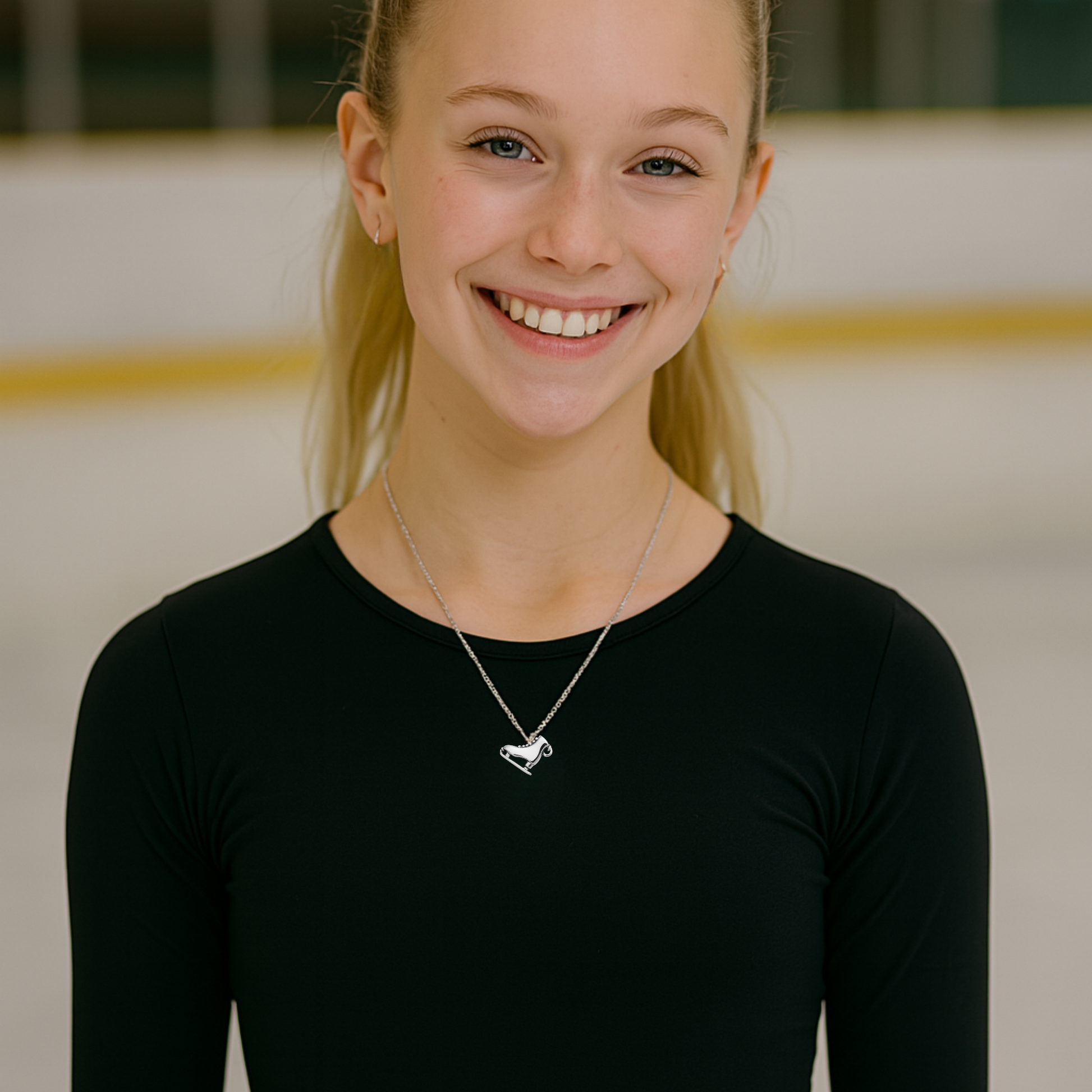 Smiling skater wearing the ice skate necklace, perfect for showcasing team spirit