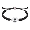 Black and white rope bracelet with stainless steel heart charm showing skater shoe design