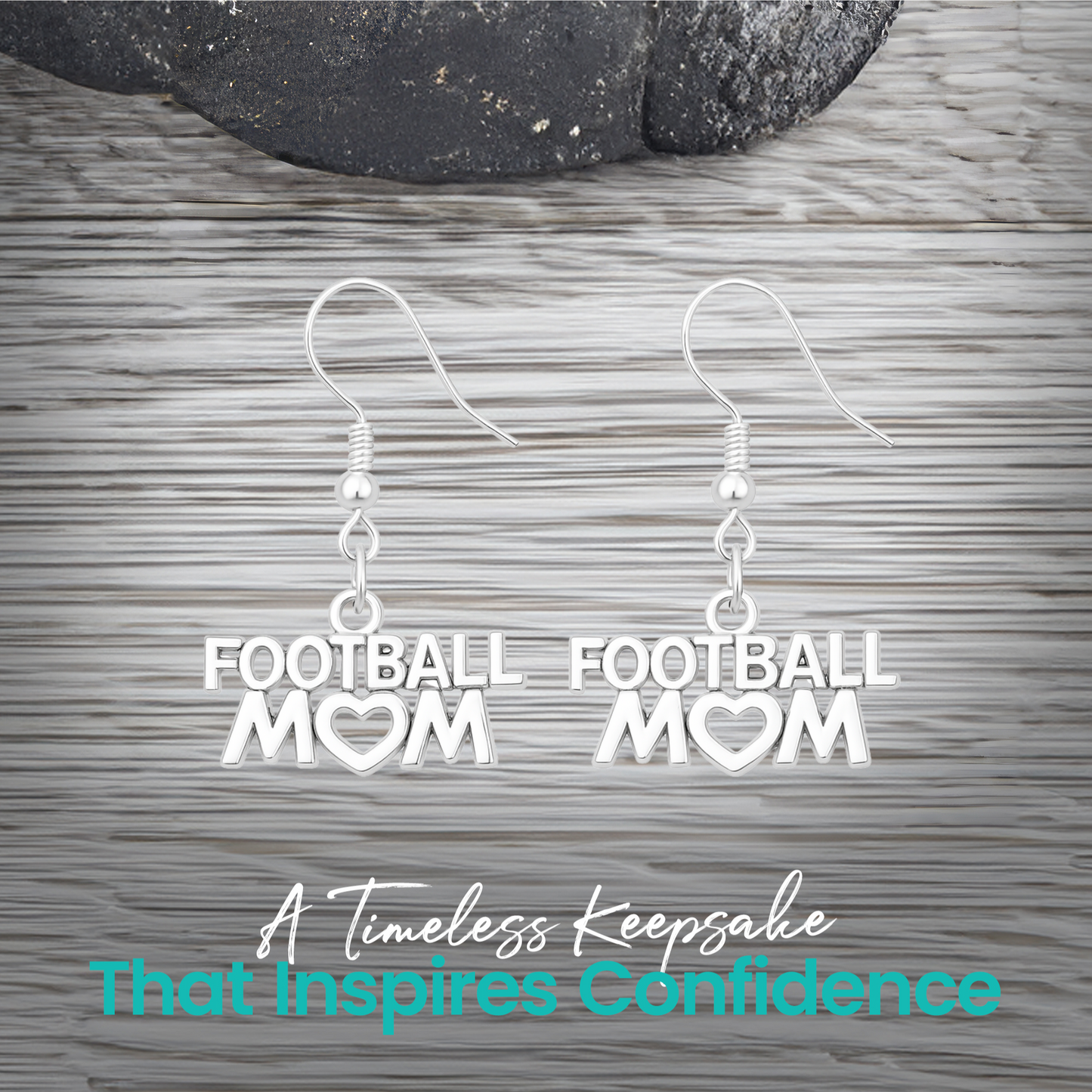 Silver Football Mom earrings displayed on rustic wooden surface