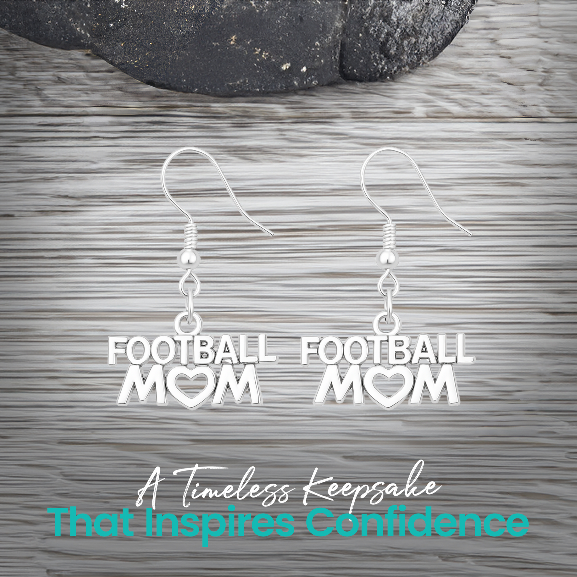 Silver Football Mom earrings displayed on rustic wooden surface