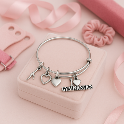 Girls gymnastics charm bracelet with word charm and heart details, silver wire bangle style