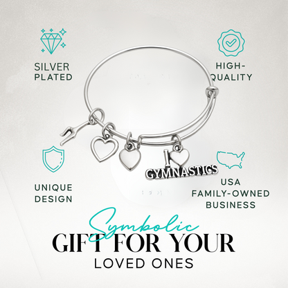 Silver gymnastics bracelet with heart and gymnast charms, shown on display card with product info