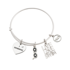 Silver-plated swim bangle bracelet with swimmer figure charm, 'Love Swim' charm, and inspirational word charm
