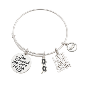 Silver swimmer bangle bracelet with 'She Believed She Could So She Did' charm, swimmer figure charm, and 'Love Swim' charm